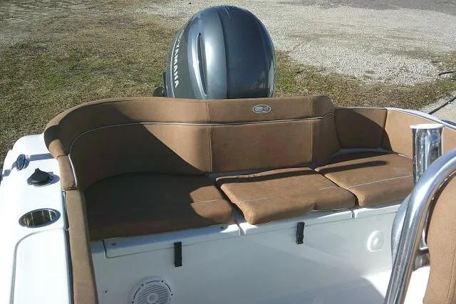 Slide: The Image of 2023 Sea Hunt Ultra 234 boat with brown seating and Yamaha engine. - 28