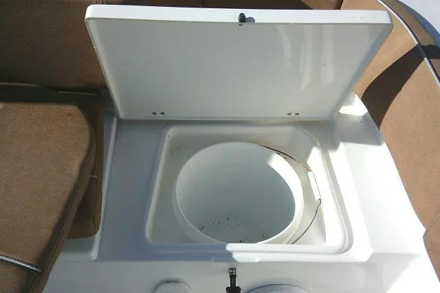 Slide: The Image of Open storage compartment on 2023 Sea Hunt Ultra 234 boat. - 31
