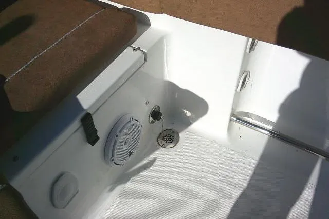 Slide: The Image of Interior view of 2023 Sea Hunt Ultra 234 boat, featuring seating and drainage system. - 34