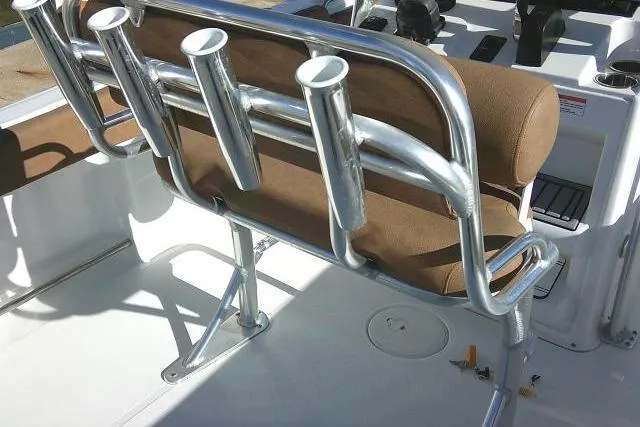 Slide: The Image of 2023 Sea Hunt Ultra 234 boat with rod holders and cushioned seating. - 35