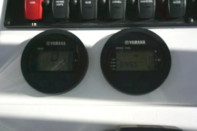 Slide: The Image of Yamaha gauges on 2023 Sea Hunt Ultra 234 boat dashboard. - 38
