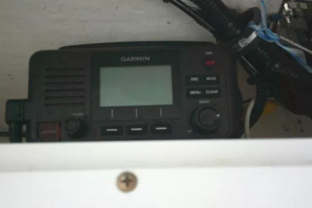 Slide: The Image of Garmin marine radio installed on 2023 Sea Hunt Ultra 234 boat dashboard. - 39