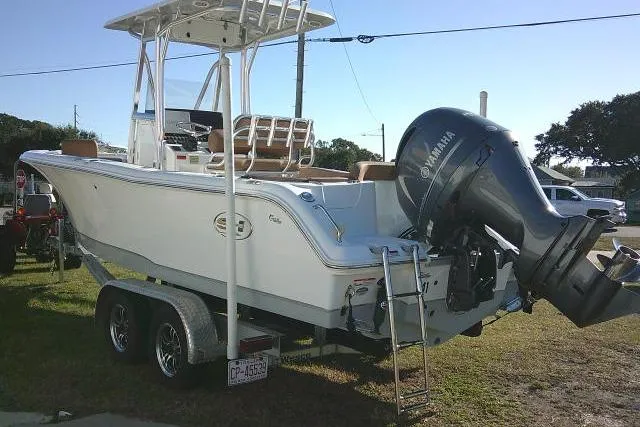 Slide: The Image of 2023 Sea Hunt Ultra 234 boat on trailer with Yamaha outboard motor. - 9