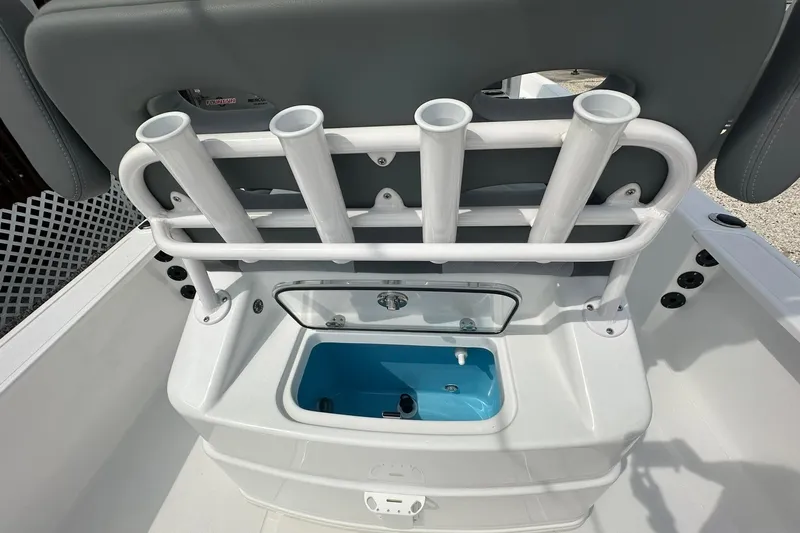 Slide: The Image of 2024 NauticStar 274 Bay boat with rod holders and livewell. - 5