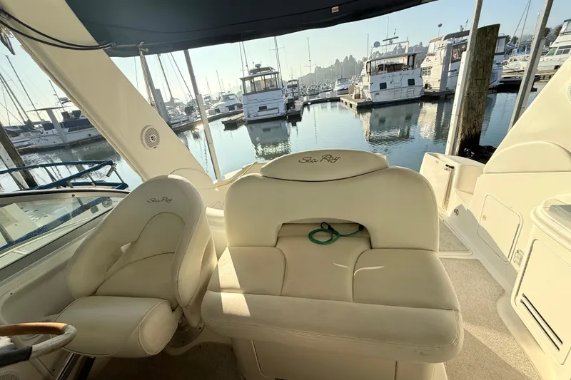 Slide: The Image of Interior of 2001 Sea Ray 340 Sundancer yacht with marina view in background. - 12