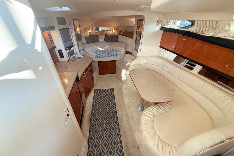 Slide: The Image of Interior of 2001 Sea Ray 340 Sundancer yacht with cozy seating and elegant design. - 15