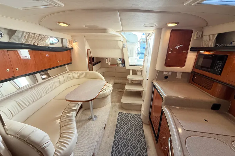 Slide: The Image of Luxurious interior of 2001 Sea Ray 340 Sundancer yacht with plush seating and modern amenities. - 20