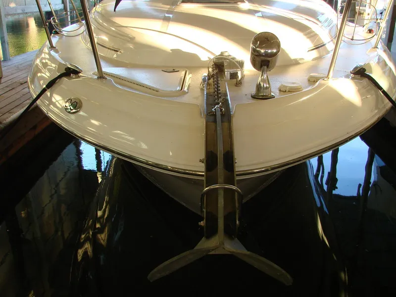 Slide: The Image of Front view of a 2001 Sea Ray 340 Sundancer in dock. - 8