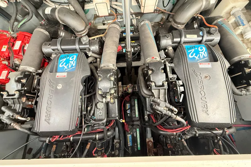 Slide: The Image of Engine room of a 2001 Sea Ray 340 Sundancer with twin Mercury engines. - 28