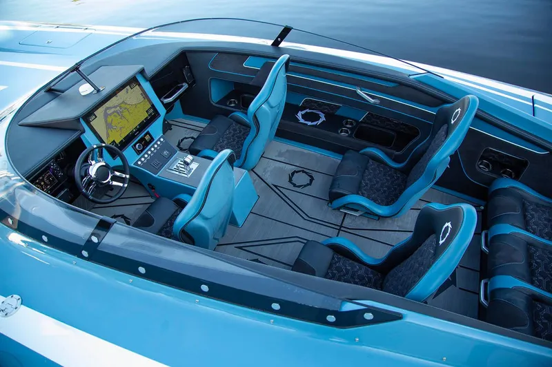 Slide: The Image of Manufacturer Provided Image: 2026 Fountain 34 Thundercat boat interior with modern dashboard and blue seating. - 1