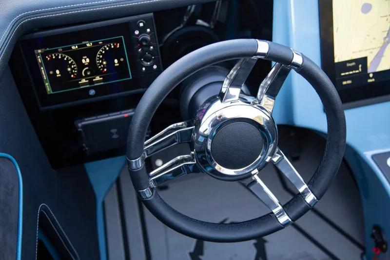 Slide: The Image of 2026 Fountain 34 Thundercat dashboard with sleek steering wheel and digital displays. - 10