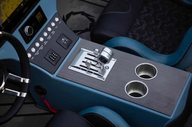 Slide: The Image of 2026 Fountain 34 Thundercat boat interior with control panel and cup holders. - 12