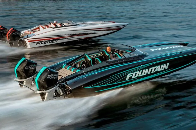 Slide: The Image of 2026 Fountain 34 Thundercat speedboats racing on water, showcasing sleek design and powerful engines. - 13