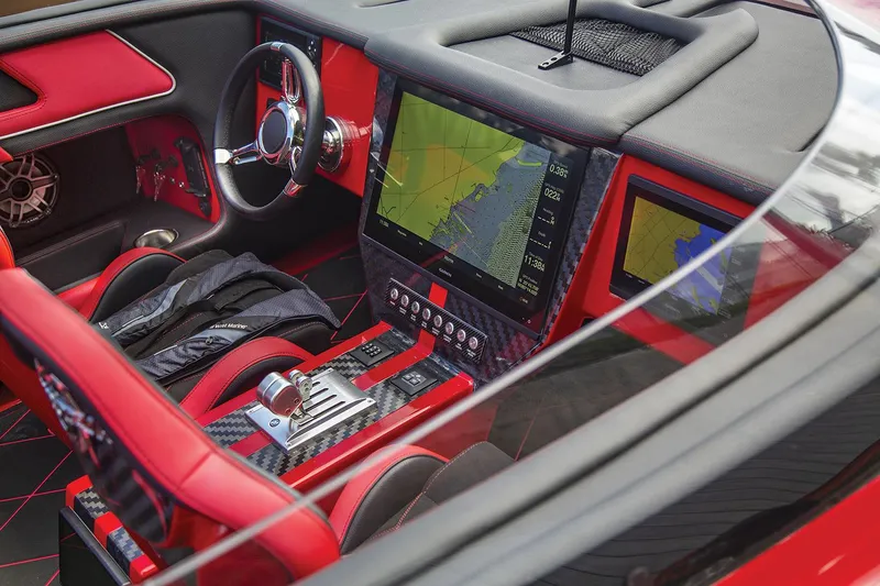 Slide: The Image of Manufacturer Provided Image: Interior of 2026 Fountain 34 Thundercat with red accents and advanced navigation system. - 2