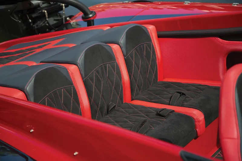 Slide: The Image of Red and black interior seating of 2026 Fountain 34 Thundercat boat. - 3