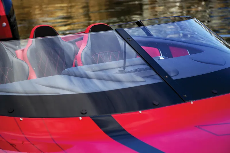 Slide: The Image of 2026 Fountain 34 Thundercat boat interior with sleek red and black seats. - 4