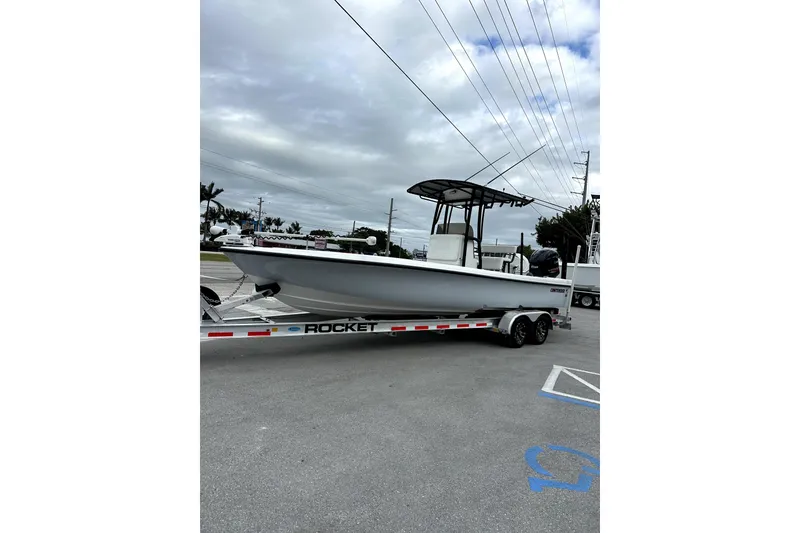 Slide: The Image of 2021 Contender 25 Bay boat interior with Garmin navigation system and steering wheel. - 10
