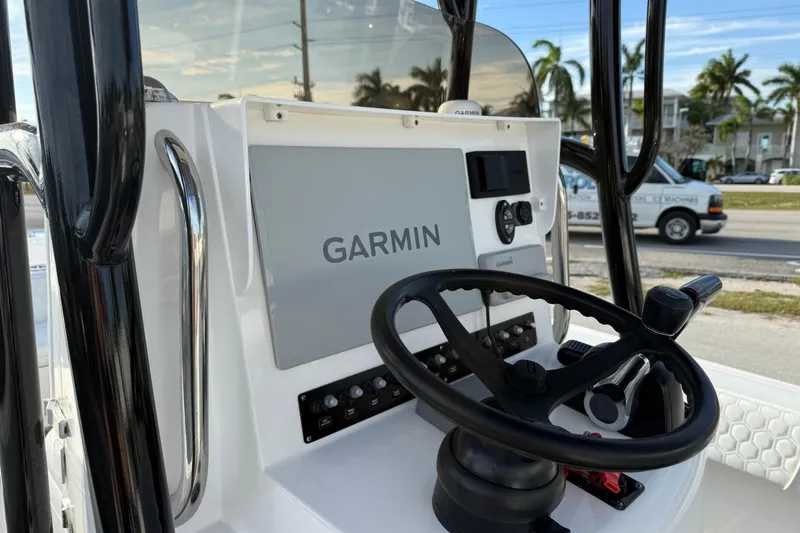 Slide: The Image of 2021 Contender 25 Bay boat console with Garmin navigation system and steering wheel. - 14
