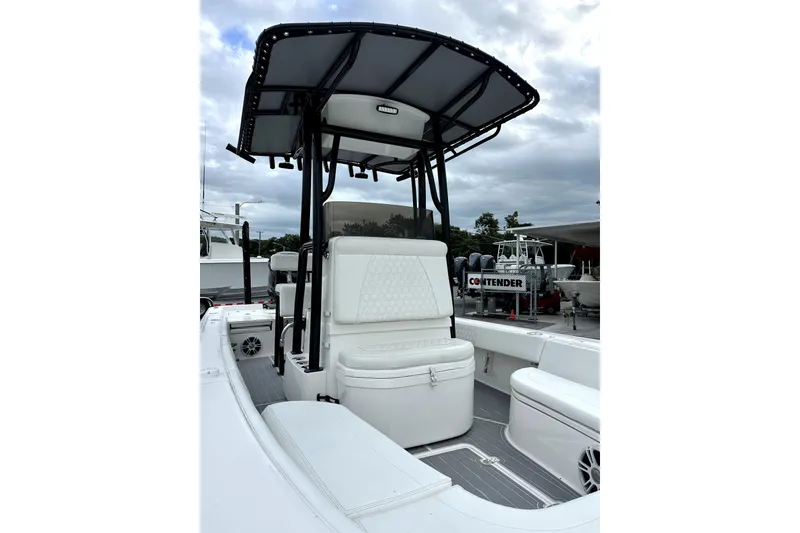 Slide: The Image of 2021 Contender 25 Bay boat interior with Garmin navigation system and steering wheel. - 9