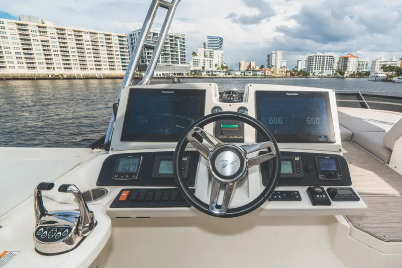 Slide: The Image of 2017 Sea Ray L650 Fly yacht helm with modern navigation displays and controls. - 16
