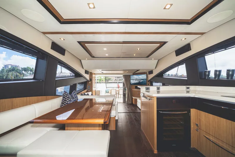 Slide: The Image of Luxurious interior of 2017 Sea Ray L650 Fly yacht with modern dining and kitchen area. - 18