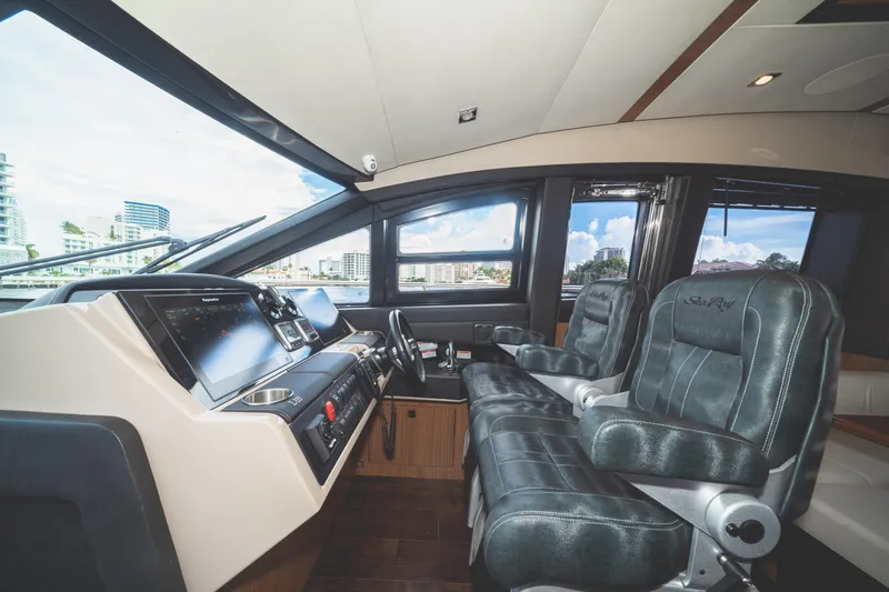 Slide: The Image of Luxurious 2017 Sea Ray L650 Fly yacht cockpit with modern navigation systems and plush seating. - 21