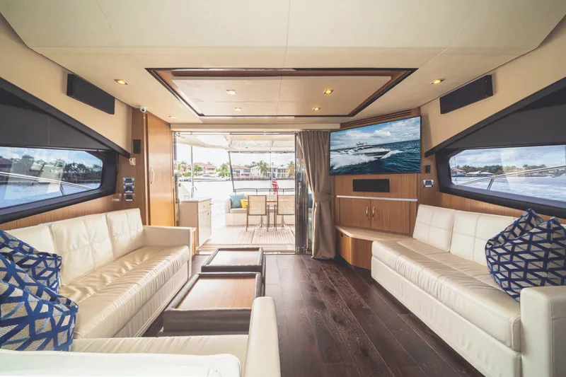 Slide: The Image of Luxurious interior of 2017 Sea Ray L650 Fly yacht with elegant seating and large windows. - 24