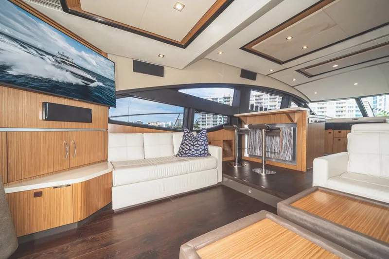 Slide: The Image of Luxurious interior of 2017 Sea Ray L650 Fly yacht with modern furnishings and large windows. - 27