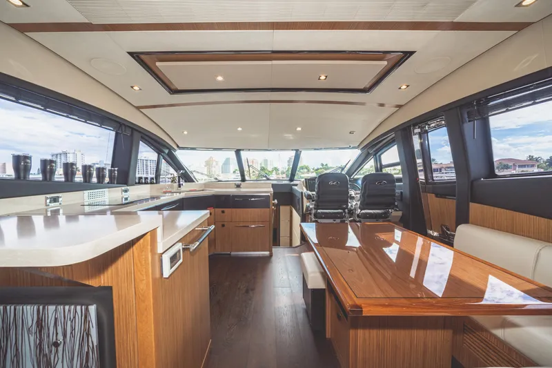 Slide: The Image of Luxurious interior of 2017 Sea Ray L650 Fly yacht with modern design and panoramic windows. - 28