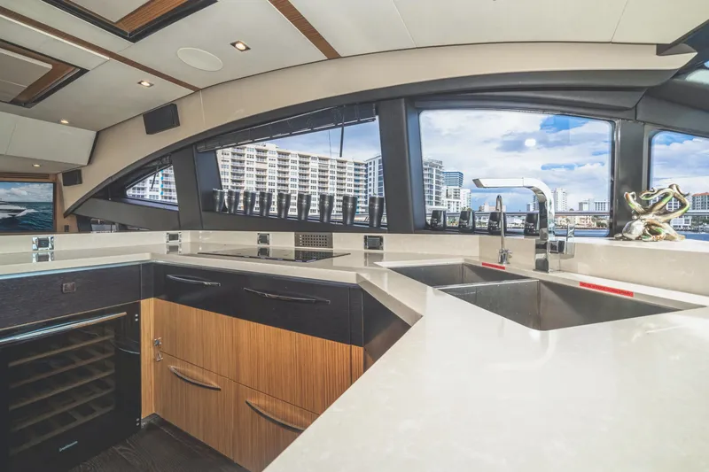 Slide: The Image of Luxurious kitchen interior of 2017 Sea Ray L650 Fly yacht with modern design and cityscape view. - 31