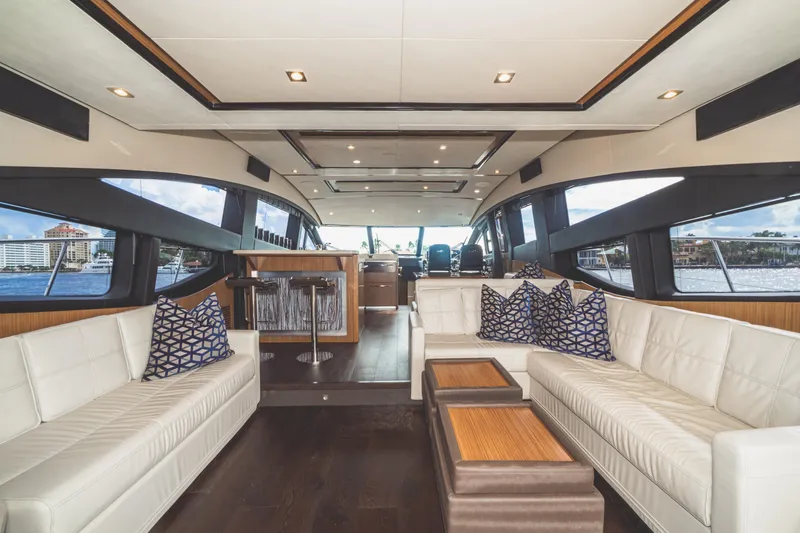 Slide: The Image of Luxurious interior of 2017 Sea Ray L650 Fly yacht with elegant seating and panoramic windows. - 32