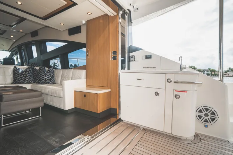 Slide: The Image of Luxurious interior of 2017 Sea Ray L650 Fly yacht with modern seating and kitchenette. - 34