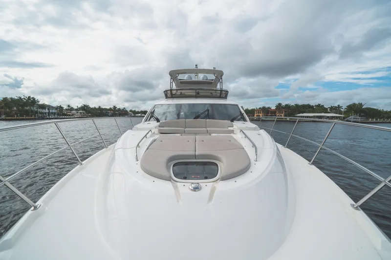 Slide: The Image of 2017 Sea Ray L650 Fly yacht on water under cloudy sky. - 39