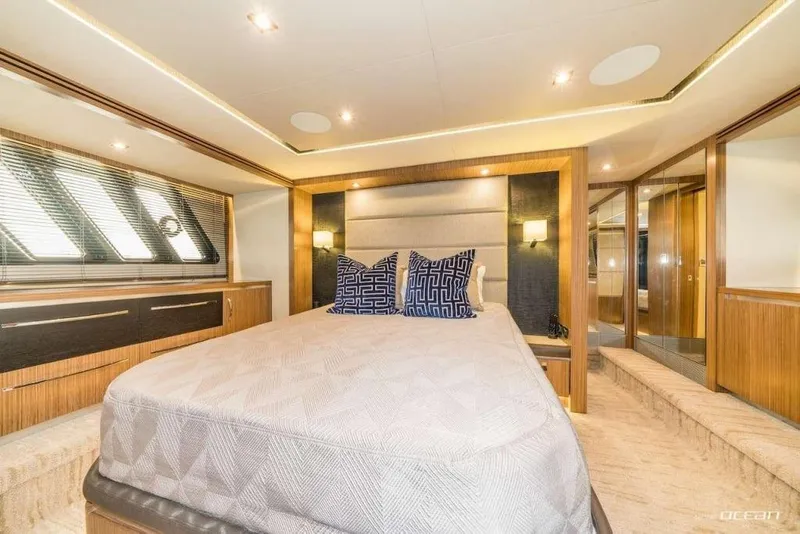 Slide: The Image of Luxurious bedroom interior of 2017 Sea Ray L650 Fly yacht with modern design elements. - 5
