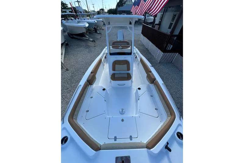 Slide: The Image of 2025 NauticStar 231 Hybrid boat with spacious seating and sleek design. - 4