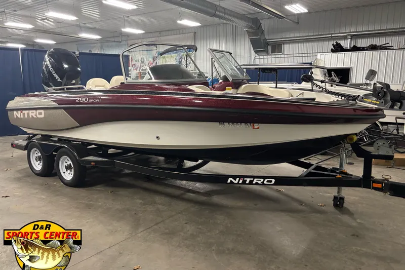 The Image of 2009 Nitro 290 Sport boat on trailer in indoor showroom at D&R Sports Center. - 0