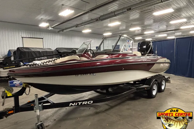 Slide: The Image of 2009 Nitro 290 Sport boat on trailer in indoor showroom. - 1