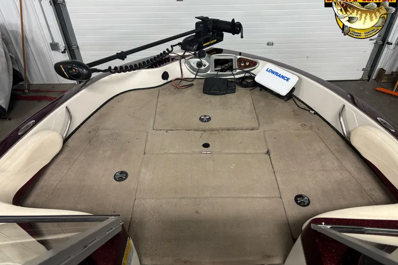 Slide: The Image of 2009 Nitro 290 Sport boat interior with fishing equipment and Lowrance device. - 5