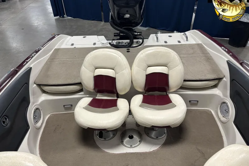 Slide: The Image of 2009 Nitro 290 Sport boat interior with dual cushioned seats and carpeted flooring. - 8