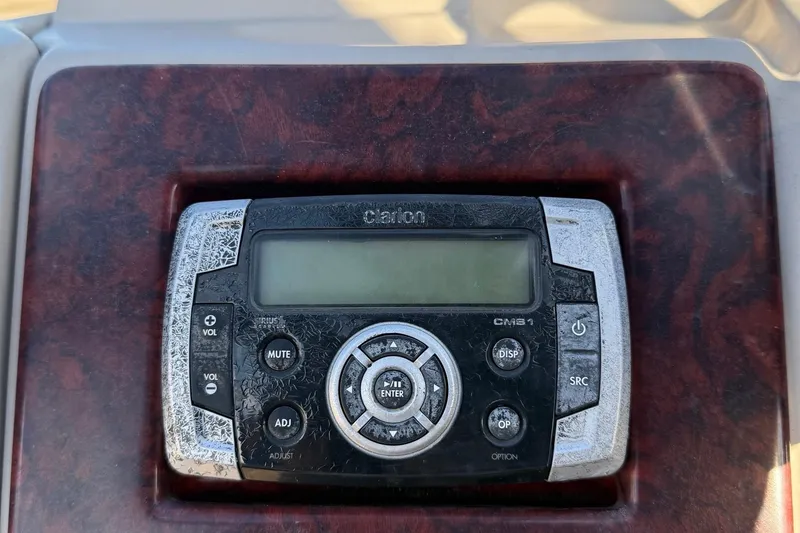 Slide: The Image of Control panel of a 2012 Berkshire 210CL Premium boat with Clarion CMS1 system. - 15