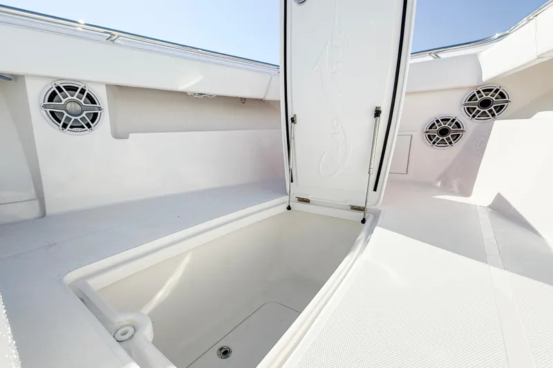 Slide: The Image of Open storage compartment on 2026 Blackwater 41 Sportfish boat deck with speakers. - 35
