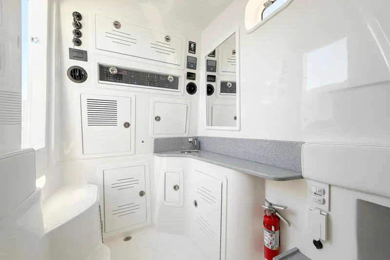 Slide: The Image of Interior of 2026 Blackwater 41 Sportfish boat featuring control panels and storage compartments. - 40