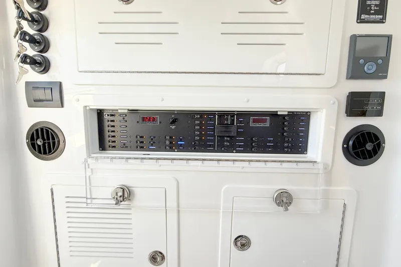 Slide: The Image of Control panel of 2026 Blackwater 41 Sportfish boat, featuring switches and ventilation. - 41