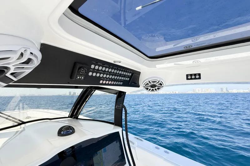Slide: The Image of Interior view of 2026 Blackwater 41 Sportfish boat with ocean and city skyline. - 49
