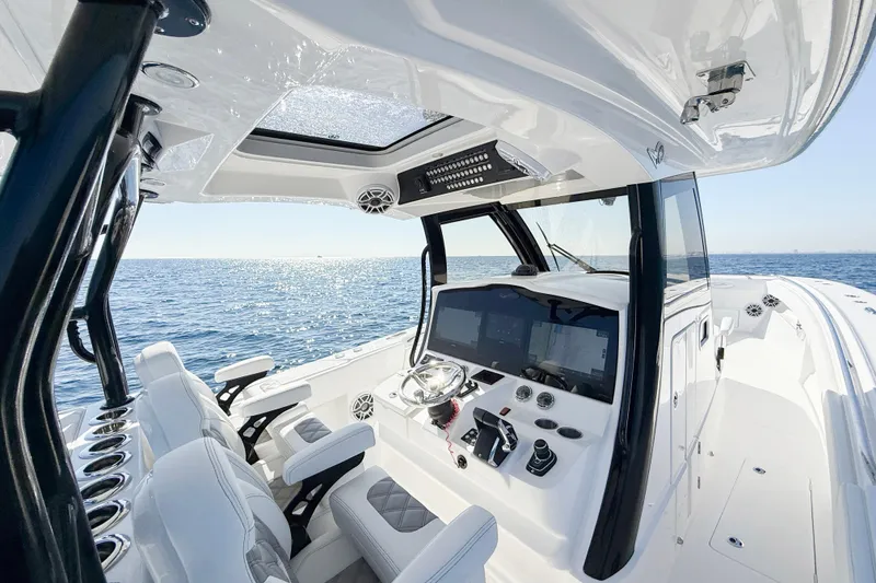 Slide: The Image of Interior of 2026 Blackwater 41 Sportfish boat with modern controls and ocean view. - 50