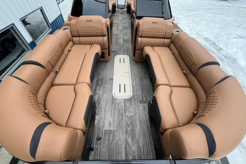 Slide: The Image of Luxurious interior of 2026 Avalon Excalibur LTD Quad Lounge with tan leather seating. - 12
