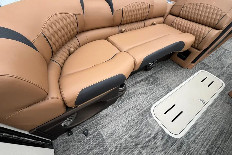 Slide: The Image of Luxurious tan seating in 2026 Avalon Excalibur LTD Quad Lounge boat interior. - 13