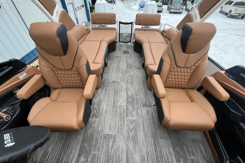 Slide: The Image of Luxurious interior of 2026 Avalon Excalibur LTD Quad Lounge with tan leather seating. - 16