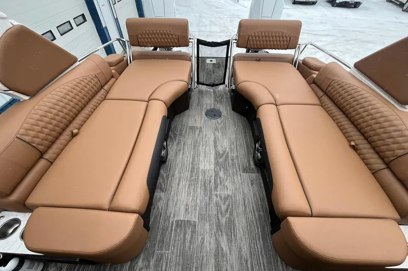 Slide: The Image of Luxurious interior of 2026 Avalon Excalibur LTD Quad Lounge with tan leather seating. - 17