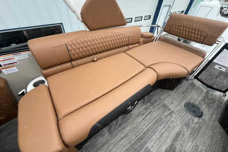 Slide: The Image of Luxurious brown seating on 2026 Avalon Excalibur LTD Quad Lounge boat. - 18